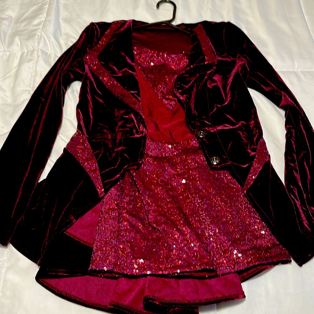 Two piece rich burgundy color is velvet and sequins.